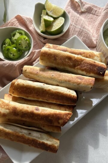Beef taquitos on plate.