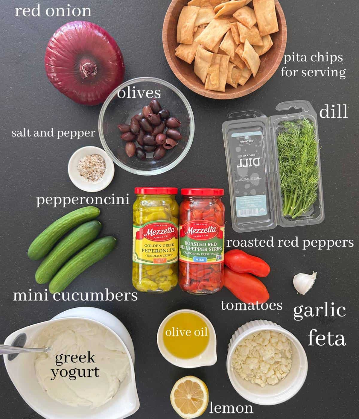 Ingredients for greek dip on counter.