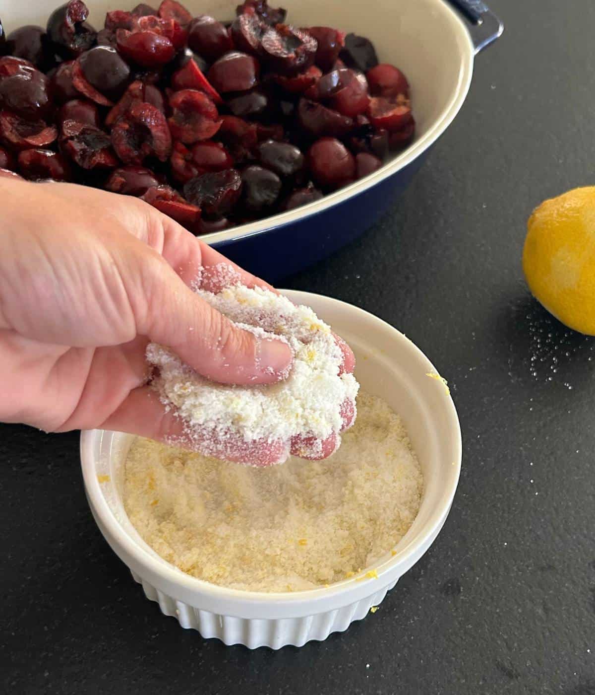 Sugar and lemon zest mixing.