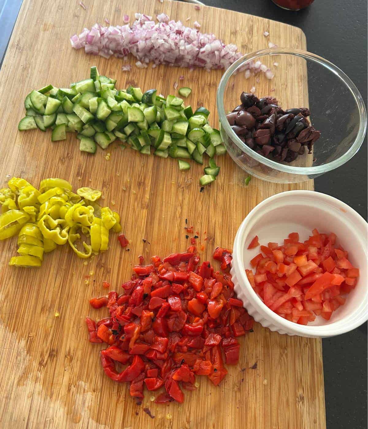 Vegetables cut up on cutting board.
