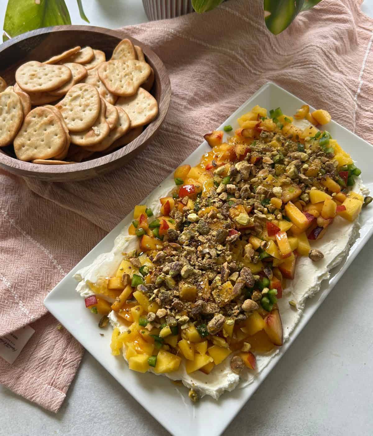 Goat Cheese dip layered with peaches and mango.