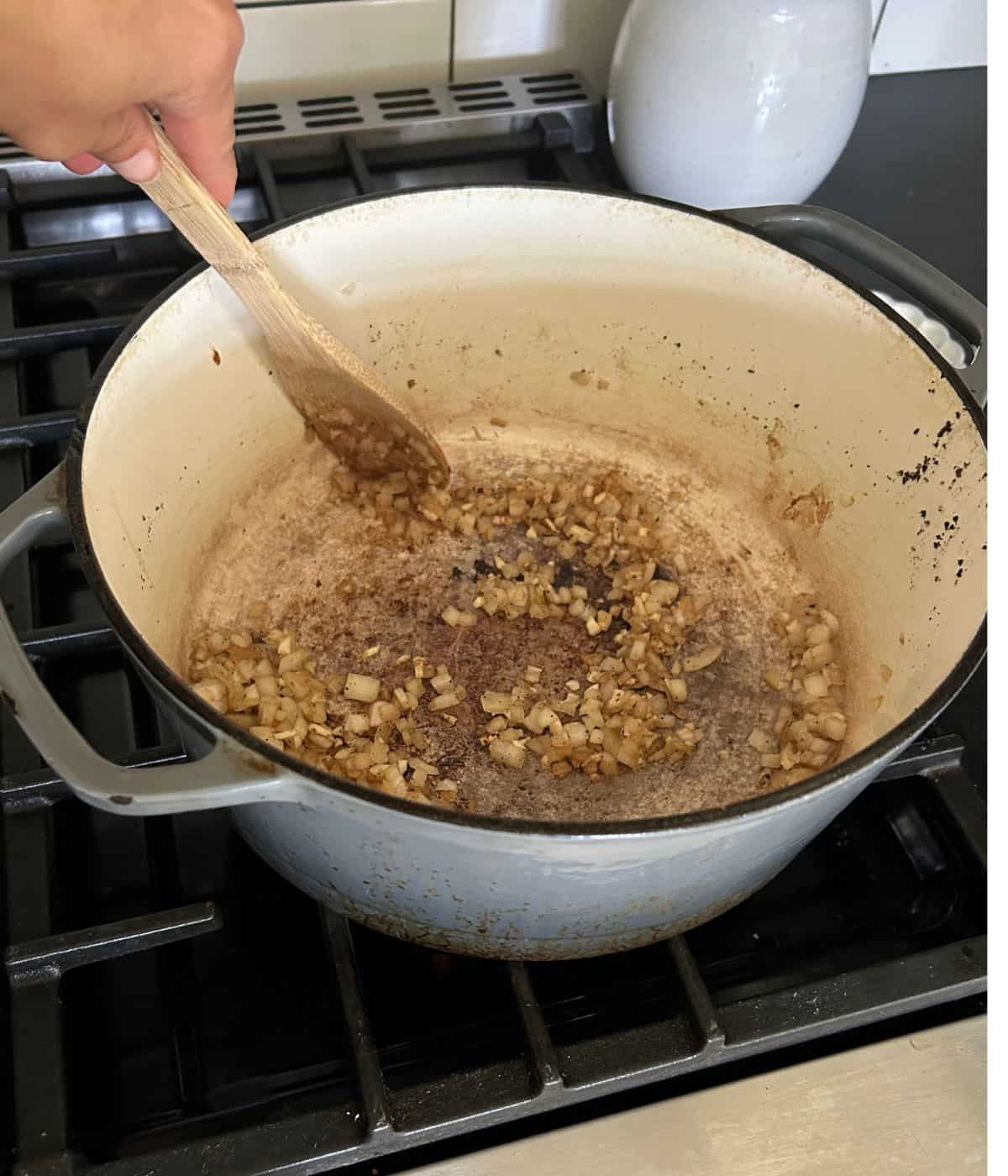 Onions and garlic cooking in dutch oven.