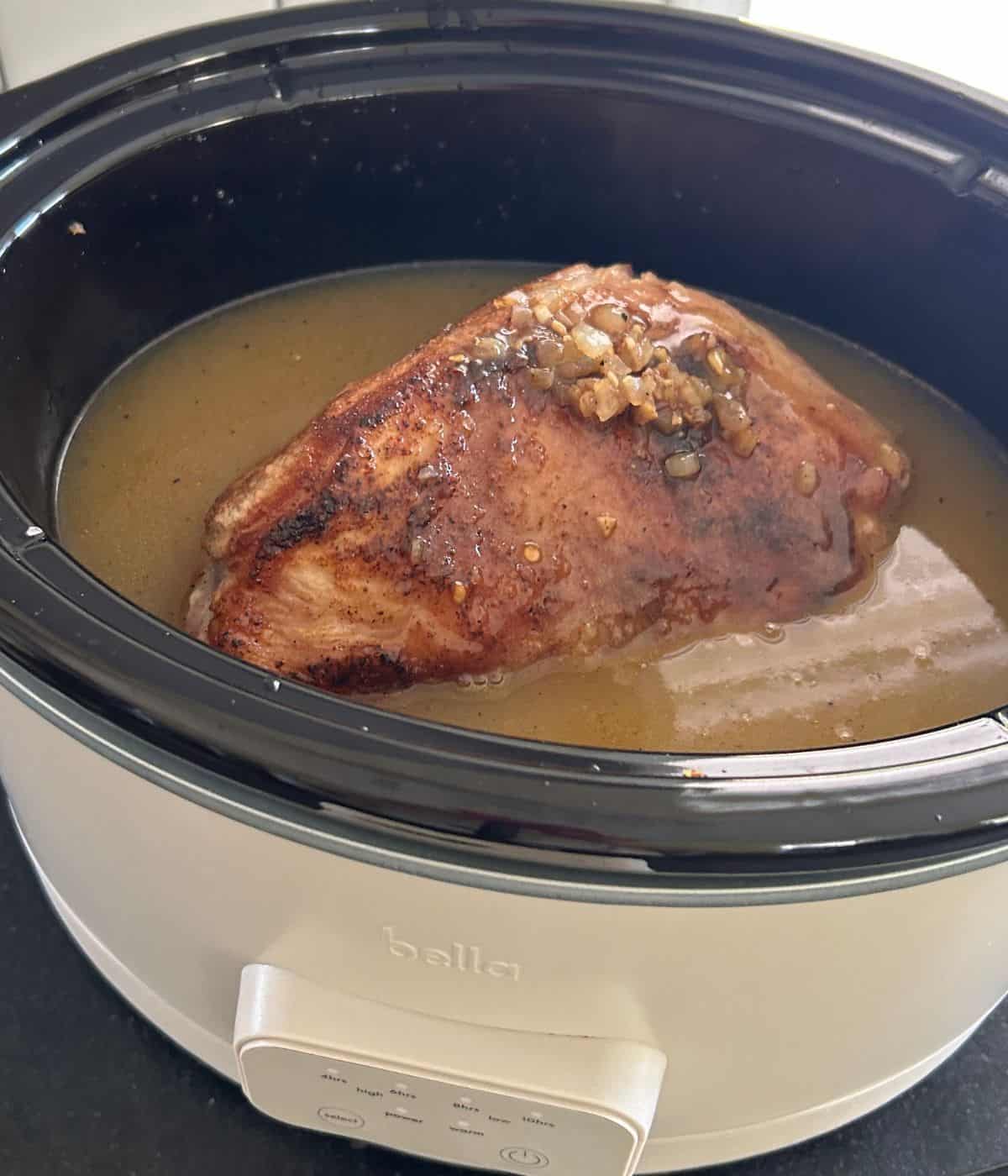Pork shoulder in slow cooker.