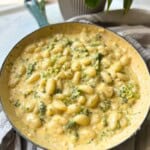 Broccoli cheese gnocchi in skillet.