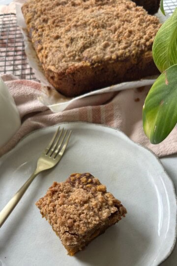 Serving pumpkin coffee cake on plate.