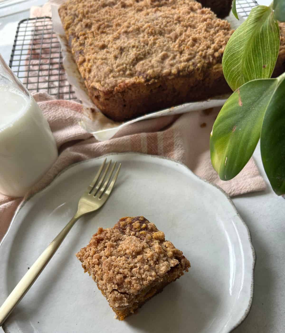 Serving pumpkin coffee cake on plate.