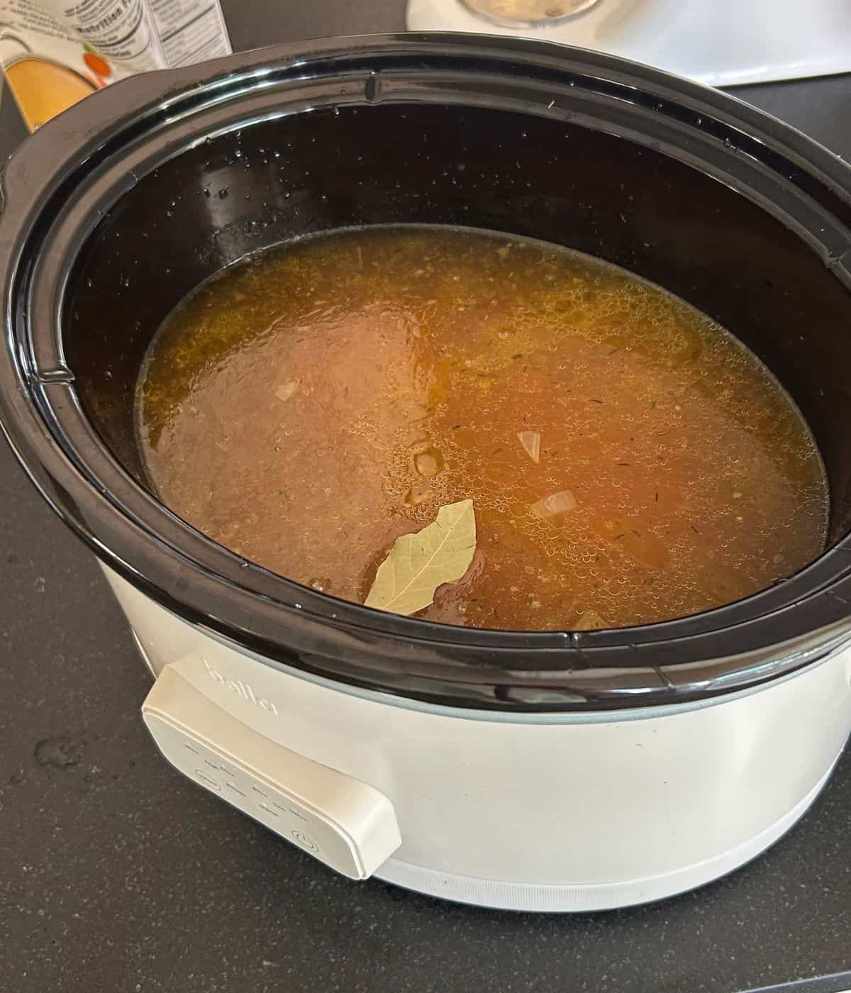 Chicken, veggies and stock in the crockpot.
