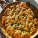 Chicken pot pie with puff pastry crust.
