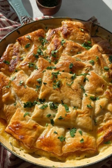 Chicken pot pie with puff pastry crust.